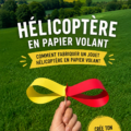 Un hélicoptère en papier coloré sur un fond en extérieur