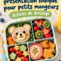 Bento box colorée pour enfants avec des fruits et légumes coupés de manière ludique.